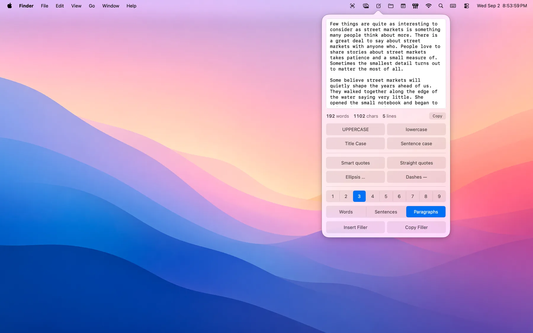 TextBuddy's menu-bar scratch pad open over the desktop, generating filler paragraphs with the case and punctuation buttons